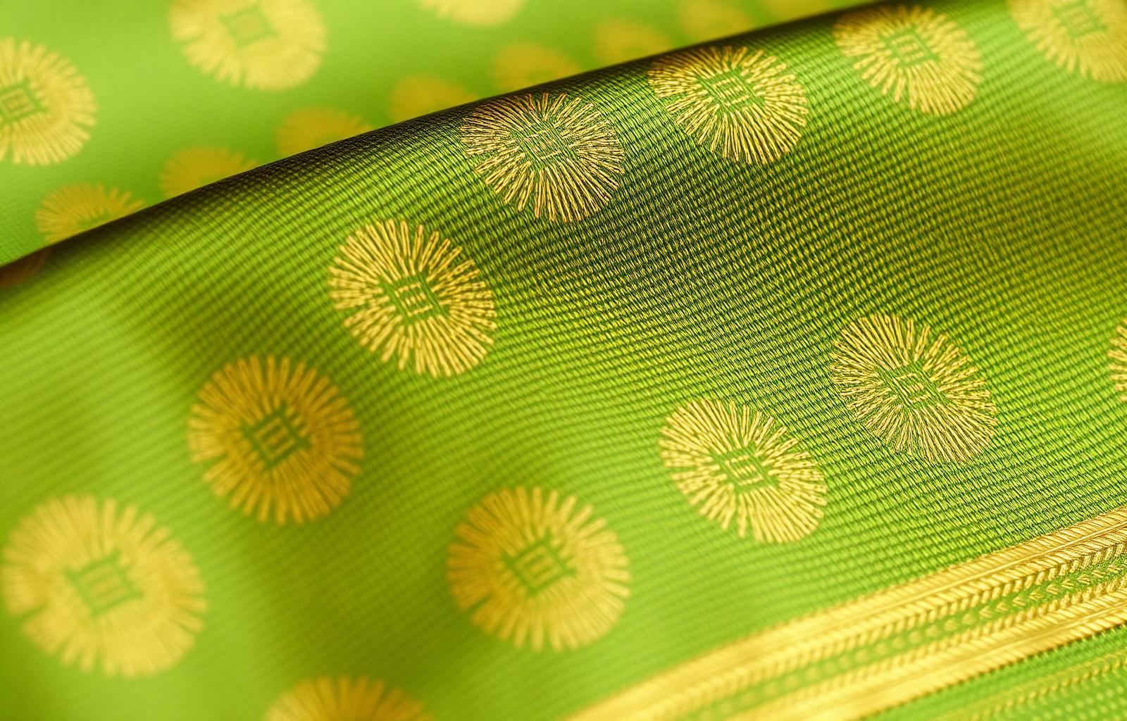 Macro of green and gold brocade